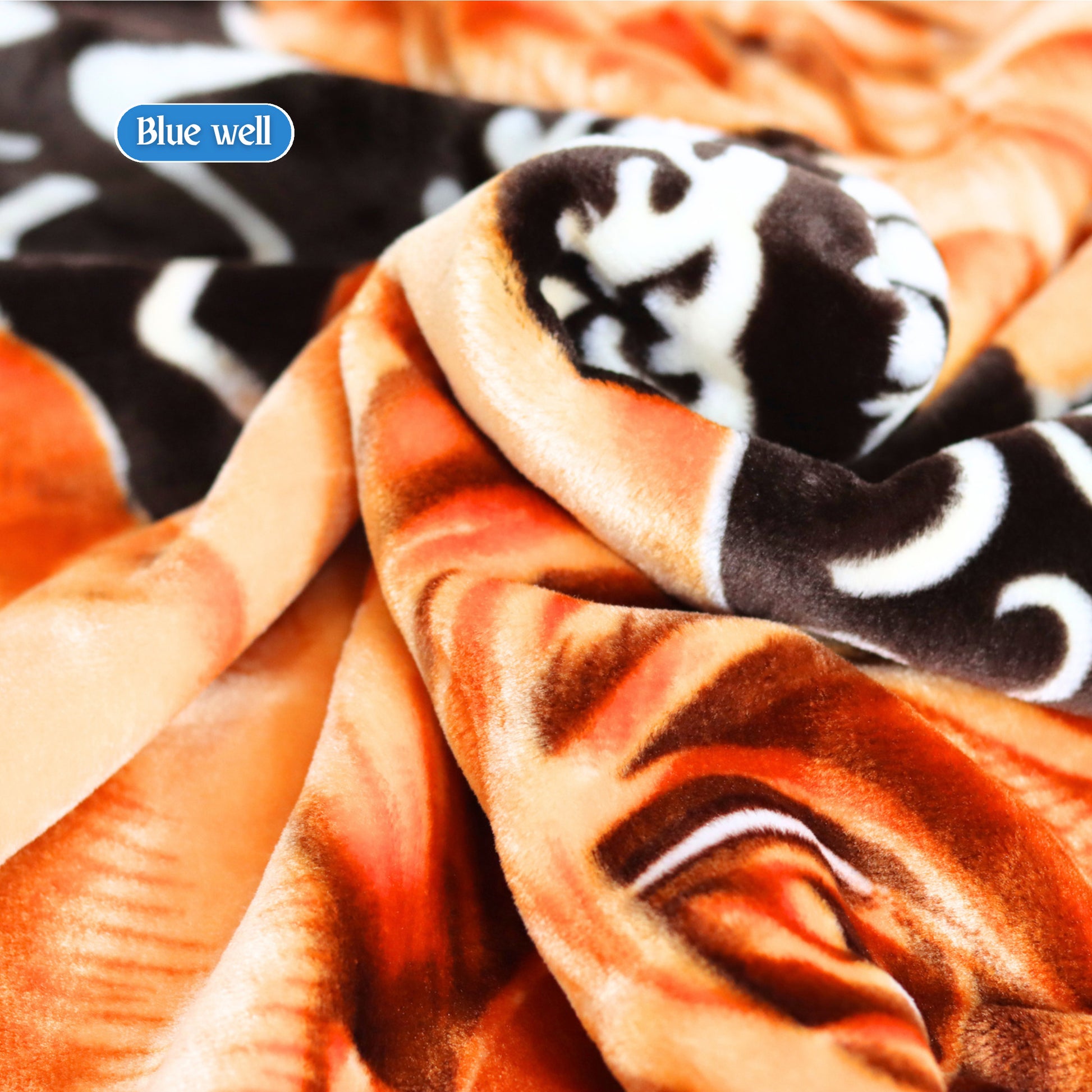 Close-Up of Blue Well Blanket Texture – Warm Orange & Cream Tones