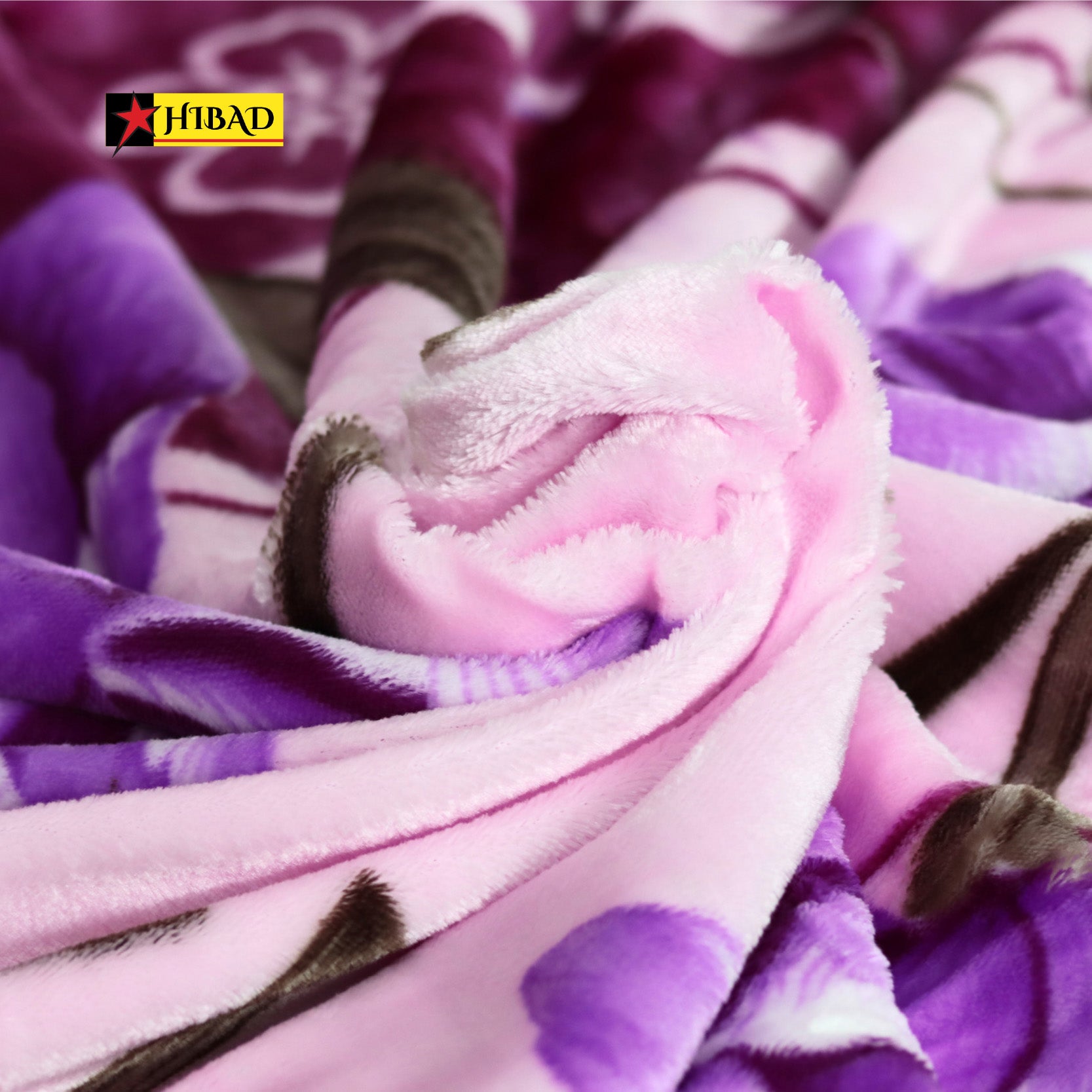 Hibad Single Blanket in shades of purple and pink, adorned with floral and abstract patterns. Made from soft Raschel fabric for a luxurious and durable experience.